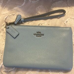 Coach wristlet w/ zip top closure. Blue color    Barely used